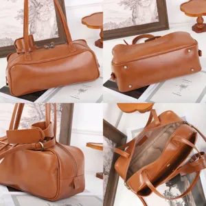 Minimalist genuine leather bowling bag, stylish brown boston handbag with large capacity.