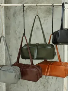 Minimalist vegetable tanned leather boston bag, stylish large capacity shoulder handbag.