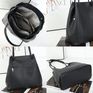 Detailed view of black leather tote bag, showing interior capacity and stitching craftsmanship.