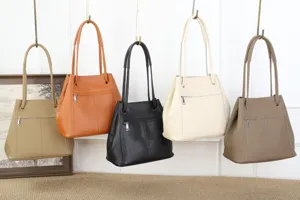 Retro genuine leather bucket bag for women, large capacity shoulder tote bag with front zipper.