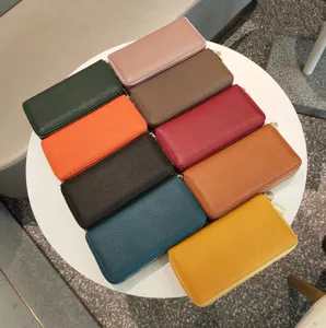 Long dual zipper leather wallet for women and men, multiple card slots, solid color design.