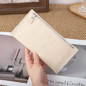 Minimalist genuine leather long wallet for women, soft zipper coin purse in beige.