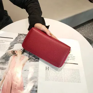 Women's genuine leather long wallet double zipper clutch coin purse with card slots.