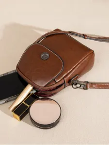 Stylish brown leather cross-body phone bag for women, multi-layer vertical shoulder bag.