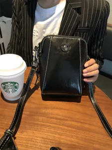 Black oil wax cowhide leather crossbody phone bag for women, trendy small shoulder bag with strap.