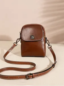 Brown genuine leather cross-body phone bag for women, vertical style with adjustable strap.