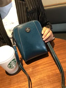 Stylish oil wax leather crossbody phone bag with sunflower metal buckle and white stitching details.