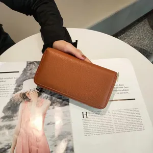 Genuine leather long zipper wallet with multiple card slots and classic brown design.