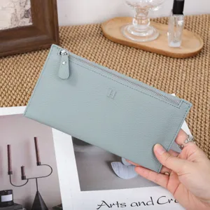 Slim leather long wallet for women with zipper closure and minimalist daily design.