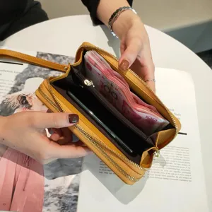 Women yellow long leather wallet with double zipper, card slots and large capacity design.