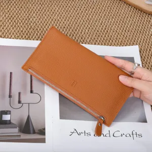 Details of brown leather long wallet, minimalist casual zipper purse with sleek finish.