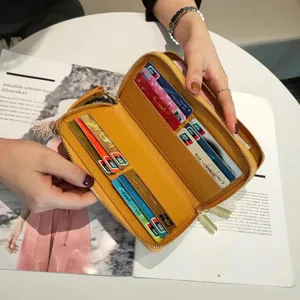 Genuine leather long wallet with double zippers and multiple card slots for women and men.