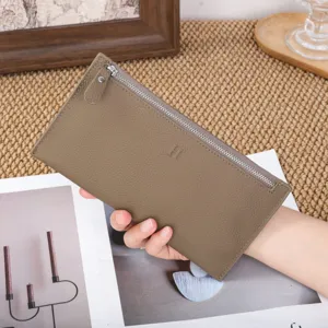 Genuine leather long wallet for women, slim minimalist zip purse with metal clasp and card slots.