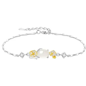 Detailed view of the silver flower bracelet featuring a central white stone and sparkling zircons.