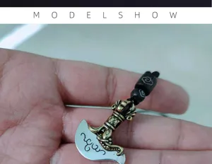 Retro vajra axe pendant necklace detail view showing exquisite totem engraving and beaded cord.