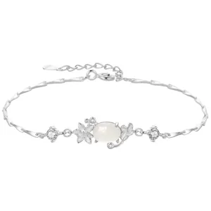 Silver flower bracelet with white chalcedony gemstone, elegant zircon charms and extension chain.