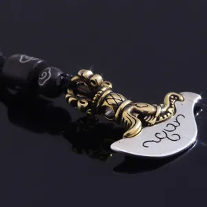 Vintage brass vajra axe pendant necklace with carved wooden beads, edgy gothic style jewelry.