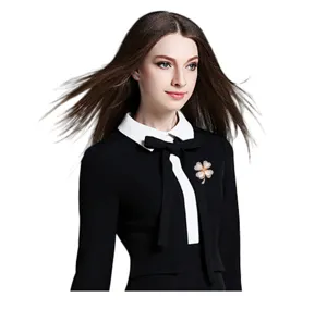 Exquisite four-leaf clover brooch detail featuring sparkling rhinestones and elegant design.