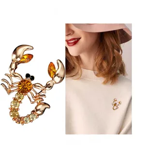 Exquisite scorpion brooch featuring sparkling yellow crystals and gold-tone alloy for women.