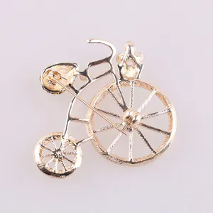 Vintage gold bicycle brooch pin, elegant lapel accessory for women suits and shirts.