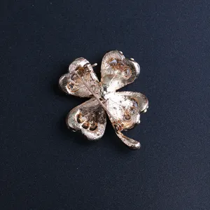 Elegant four leaf clover brooch pin for women, stylish metal corsage clothing accessory.