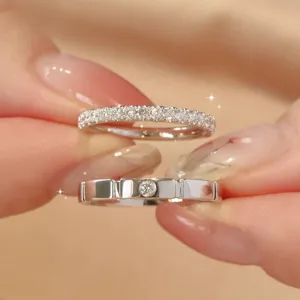 Couple rings set with pavé diamonds and sleek metal band, perfect for daily fashion wear.