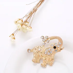 Elegant gold rhinestone elephant brooch pin, stylish animal costume jewelry accessory for women.