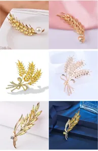 Elegant gold wheat ear brooch with yellow crystals and pearl, fashion vintage jewelry pin.