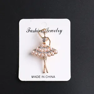 Elegant rhinestone pearl ballerina brooch pin on display card for women dress accessories.