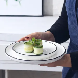Nordic style ceramic dinner plate set with black rim elegant white flat plate for kitchen