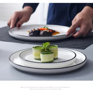 Nordic ceramic dinner plate set with elegant black rim, ideal for modern home dining.