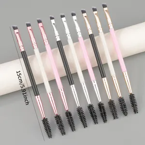 Dual-ended eyebrow brush with angled brush and spoolie for precise makeup application.