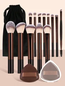 13pcs professional makeup brush set with black storage bag and two triangle powder puffs.