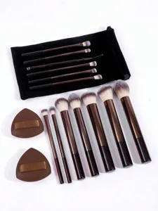 Detailed view of 13-piece brown makeup brush set with velvet bag and soft triangle powder puffs.