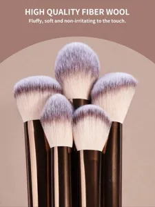 Detailed shot of soft synthetic fiber wool makeup brushes with brown ferrules for flawless face.