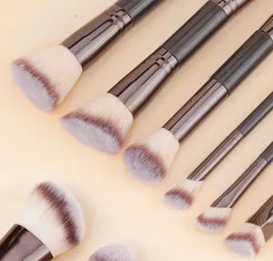 Detailed view of professional 6-piece double-ended makeup brush set with soft tri-color bristles.