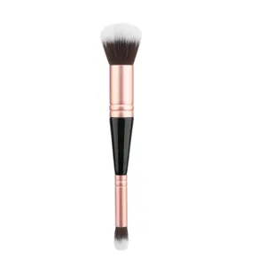Detailed view of the dual-ended makeup brush featuring synthetic bristles and rose gold ferrules.