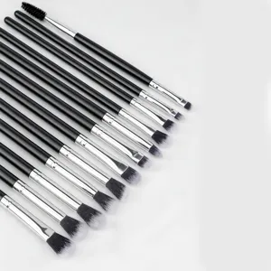 Close-up detail of 12-piece eye makeup brush set with black handles and silver ferrules.