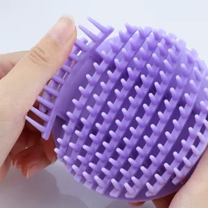 Silicone scalp massager shampoo brush close up detail view soft bristles hair care tool