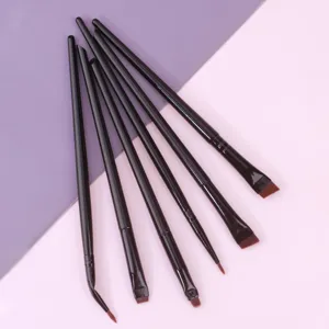 Detail shot of 6-piece black handle makeup brush set, featuring angled and flat brow brushes.