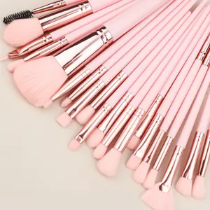 Professional pink makeup brush set details featuring soft synthetic bristles and rose gold handles.