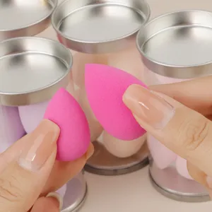 Close-up detail of mini pink makeup sponges, soft texture for flawless blending and application.