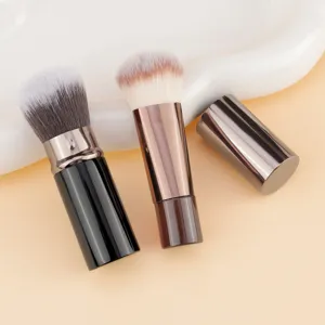 Portable 2-piece telescopic makeup brush set with cap, ideal for loose powder and blush.