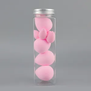 Detailed close-up view of pink makeup sponges in a clear plastic jar, soft and non-latex.