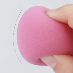 Pink makeup sponge detail soft non-latex beauty blender for flawless liquid foundation application.