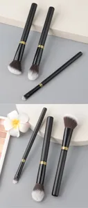 3-piece makeup brush set with black handles and soft bristles for highlighter and eyeshadow.