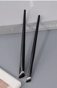 Detail view of professional angled makeup brushes with soft synthetic bristles for facial contouring.