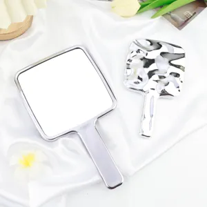 Miroir de maquillage à main portable, design élégant carré et irrégulier pour le quotidien.
