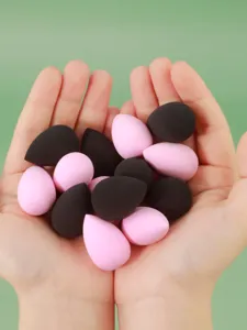 Mini makeup sponges detail shot showing dual-color teardrop soft cosmetic puffs.