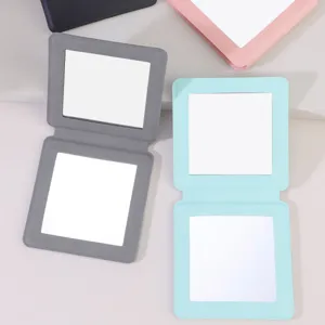 Portable square folding double-sided makeup mirror detail view showcasing multi colors.